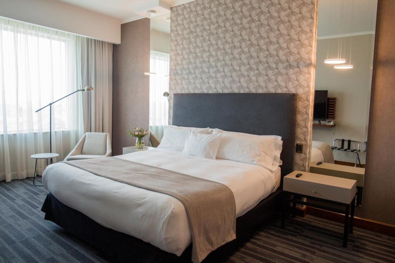 Mds Hotel 콘셉시온 외부 사진 A bedroom in a hotel